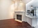 Cozy living room showcasing a fireplace, hardwood floors, and an open concept design at 807 Limerick Dr, Dallas, NC 28034