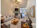 Bright and airy living room featuring a fireplace, vaulted ceiling, and neutral décor at 807 Limerick Dr, Dallas, NC 28034