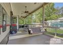 Inviting porch featuring comfortable seating and ceiling fans, creating a relaxing outdoor living space perfect for gatherings at 109 Pembrooke Trl # F171, Mount Gilead, NC 27306