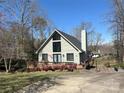 Home exterior featuring a vaulted window, cozy deck, and mature landscaping at 1220 Nw 20Th Avenue Nw Ave, Hickory, NC 28601