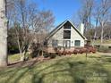 Exterior elevation featuring a cozy deck and mature landscaping at 1220 Nw 20Th Avenue Nw Ave, Hickory, NC 28601