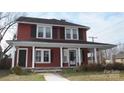 Charming two-story home with a covered front porch and classic architectural details at 129 Maupin Ave, Salisbury, NC 28144