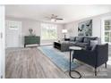 Bright living room with contemporary furnishings, neutral walls, and ample natural light at 1308 Jay Ave, Gastonia, NC 28052