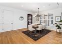 Bright dining room with hardwood floors and modern light fixture at 1333 Queens Rd # B1, Charlotte, NC 28207
