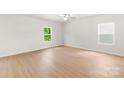 Spacious main bedroom with two bright windows and wood-look floors at 1544 Doran Ter, Richburg, SC 29729
