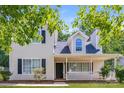 Charming two-story home with covered porch, black shutters, and manicured front yard at 1569 Brentfield Dr, Rock Hill, SC 29732