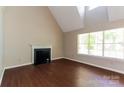 Bright living room features a fireplace, large window, and hardwood floors at 1569 Brentfield Dr, Rock Hill, SC 29732