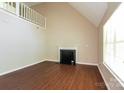Bright living room features a fireplace, large window, and hardwood floors at 1569 Brentfield Dr, Rock Hill, SC 29732