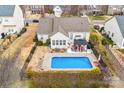 A sparkling blue pool with a surrounding patio and gazebo for outdoor enjoyment at 162 Pecan Hills Dr, Mooresville, NC 28115