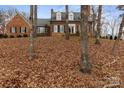 Traditional brick home with well-manicured lawn and mature trees in a desirable neighborhood at 341 Beckwick Ln, Concord, NC 28025