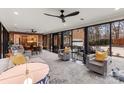 Bright living room featuring modern ceiling fans, floor-to-ceiling windows, and an open layout at 341 Beckwick Ln, Concord, NC 28025