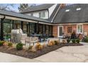 The outdoor patio features a built-in grill and ample seating for entertaining at 341 Beckwick Ln, Concord, NC 28025