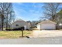 Charming home with a detached garage, wooden deck, and paved driveway at 345 Briar Creek Rd, Gastonia, NC 28056