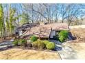 An aerial shot of a single-story home showing the landscaped front yard and a long driveway with ample parking at 5011 Tara Tea Dr, Tega Cay, SC 29708