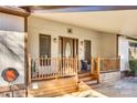 Inviting covered front porch, perfect for relaxing, showcasing nice wood railings and neutral exterior colors at 5011 Tara Tea Dr, Tega Cay, SC 29708