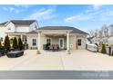 Spacious outdoor patio featuring ample seating and a covered dining area, ideal for entertaining guests at 5041 Wakehurst St, Kannapolis, NC 28081