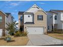 Charming two-story home with a brick facade and two-car garage at 518 Palmarosa St, Fort Mill, SC 29715