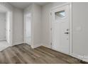 Bright entryway with hard surface floors, a white front door, and neutral wall colors at 609 Grandiflora Ave, Lancaster, SC 29720