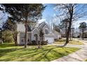 Charming two-story home featuring a well-maintained lawn and mature trees at 7533 Lady Bank Dr, Charlotte, NC 28269