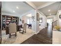 Spacious living room featuring an open layout, hardwood floors, and sophisticated decor at 10379 Black Locust Ln, Charlotte, NC 28215