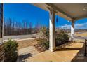 Cozy porch view showcasing the tranquil neighborhood and landscaped surroundings at 10379 Black Locust Ln, Charlotte, NC 28215
