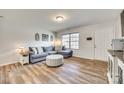 Comfortable living area with hardwood style floors and neutral paint colors at 1076 Westminster Dr, Lancaster, SC 29720
