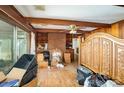 Spacious living room with wood beams, brick fireplace and an ornate bed at 1120 Crestview Ave, Salisbury, NC 28144