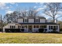 Charming two-story home with a welcoming front porch and well-maintained landscaping at 1201 Edgefield Ave, Gastonia, NC 28052