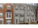 Townhome exterior featuring brick and siding facade, neutral trim, and well-maintained landscaping at 15662 King Louis Ct, Charlotte, NC 28277