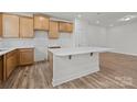Modern kitchen features wooden cabinets, white countertops, and an island with a breakfast bar at 2013 Near Point Rd # 20, Charlotte, NC 28208