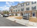 Attractive townhomes with well-manicured lawns and convenient parking at 2311 Doby Creek Ln, Charlotte, NC 28262