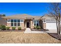 Charming single-story brick home with a well-maintained lawn and a welcoming front entrance at 2914 Hiddenbrook Way, Indian Land, SC 29707