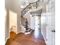 Elegant staircase with wood and iron detailing, seamlessly connecting different levels of the home at 8315 Bridgegate Dr, Huntersville, NC 28078