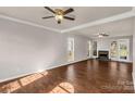 Spacious living room boasts hardwood floors, fireplace, and plenty of natural light at 9138 Babbitt Way, Charlotte, NC 28216