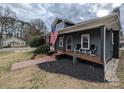 Inviting home with a cozy front porch perfect for relaxing, featuring elegant seating and stylish decor at 101 Sunset Dr, Stanley, NC 28164