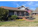 Quaint home with a covered front porch and well-maintained front yard at 101 Sunset Dr, Stanley, NC 28164