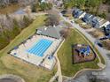 Overhead view of the community pool, playground, and surrounding neighborhood at 113 Burlingame Ct # D, Mooresville, NC 28117