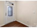 View of entryway with decorative glass door and hardwood floors at 113 Burlingame Ct # D, Mooresville, NC 28117