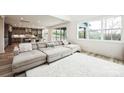 Bright and airy living room featuring a comfortable sectional sofa, plush rug, and plenty of natural light at 147 Windy Dell Dr, Tega Cay, SC 29708