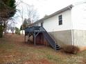 Inviting back deck and stairs offer seamless outdoor access and enhances the home's exterior appeal at 1609 Indian Springs Nw Dr # 35, Conover, NC 28613