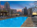 Stunning rooftop pool with city views, lounge chairs, and a relaxing atmosphere at 210 N Church St # 1612, Charlotte, NC 28202