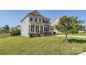 Well-maintained two-story home with a lush green lawn at 274 Sweet Briar Dr, Fort Mill, SC 29707