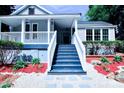 Home exterior showcasing a covered porch with painted steps and gravel stone accents at 315 Confederate St, Fort Mill, SC 29715