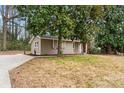 Cozy single-story home featuring a well-manicured lawn and a classic brick foundation at 5329 Southampton Rd, Charlotte, NC 28217