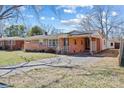 Traditional brick home boasting a covered carport and established landscaping at 602 Charles Rd, Shelby, NC 28152