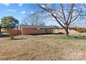 Single story brick home with a covered carport and mature trees at 602 Charles Rd, Shelby, NC 28152