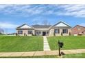 Exterior view of a brick home with manicured lawn and inviting entrance, showcasing curb appeal at 609 Rosemore Pl, Rock Hill, SC 29732