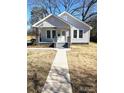Charming home with craftsman style porch, painted brick accents, and sidewalk at 723 S Confederate Ave, Rock Hill, SC 29730