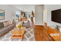 Cozy living room with hardwood floors and bright natural light at 7400 Gilead Rd, Huntersville, NC 28078