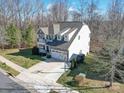 Areal view of the two-story home with basketball court, well manicured lawn and tree lined backyard at 7504 Canova Ln # 5, Charlotte, NC 28278